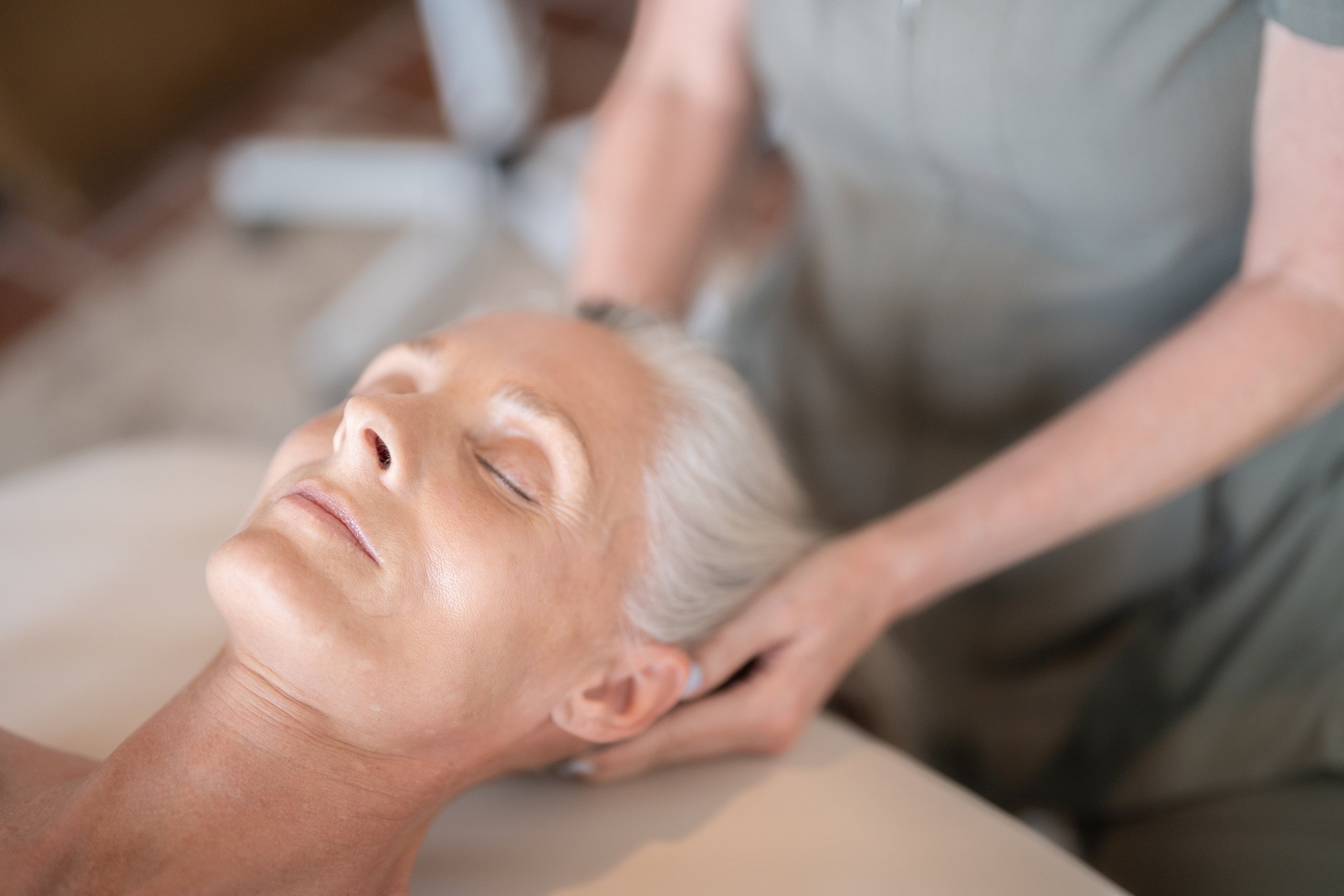 Old woman getting a massage